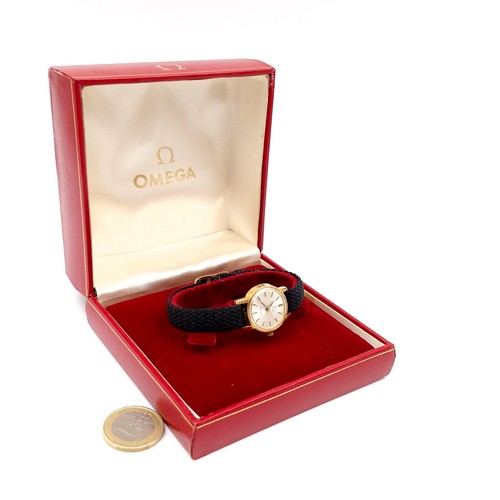 981 - Star Lot : A beautiful designer Omega Geneve Swiss made ladies wristwatch with black woven strap. Se... 