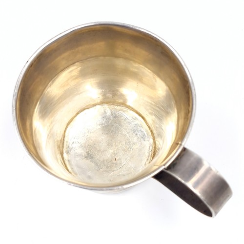 994 - A sterling silver antique cup with handle. Weight 88.07 grams. With hallmarks to base.