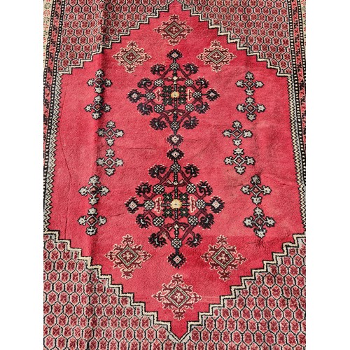 904 - Star Lot : A superb example of a hand knotted Persian style rug in vibrant tones of pinks, blues, ye... 