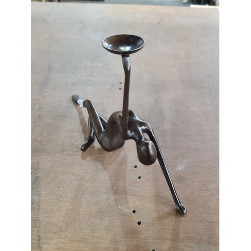 137 - Star Lot : A solid bronze Art Deco candle holder in the form of a poised female. Lovely piece.