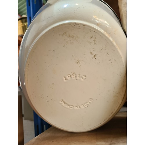 221 - An excellent example of a very large cast iron lidded casserole dish in an off white finish. Stamped... 