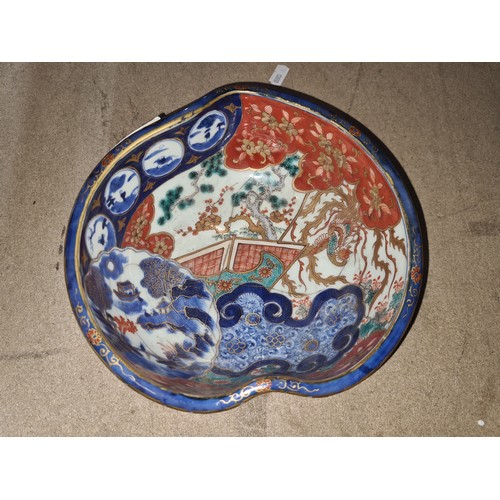 624 - Star Lot : An incredible example of an antique Japanese Imari bowl featuring the classic orange, blu... 