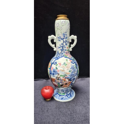 639 - Star Lot : A large unusual Japanese vase with hand painted images with a male and female figure in k... 