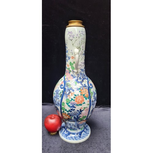 639 - Star Lot : A large unusual Japanese vase with hand painted images with a male and female figure in k... 