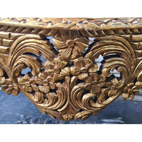 367 - A stunning luxury gilt baroque stool featuring pierced floral motifs to frame along with studded det... 