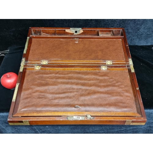 207 - A large Mahogany antique writing slope with brass hardware and additional compartments for stationar... 