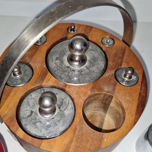 402 - An imperial kitchen metal weight set with turned wooden stand. Includes weights from 1/4 oz to 2lb.