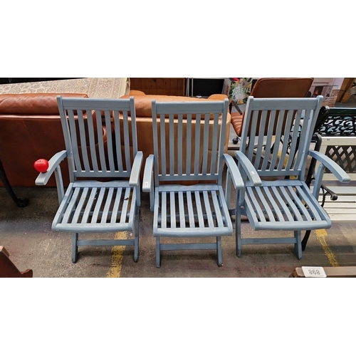 426 - Set of three blue painted wooden folding garden chairs, featuring slatted design with armrests.