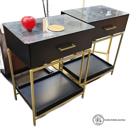 432 - Pair of contemporary side tables feature black drawers and glass tops, supported by sleek gold frame... 