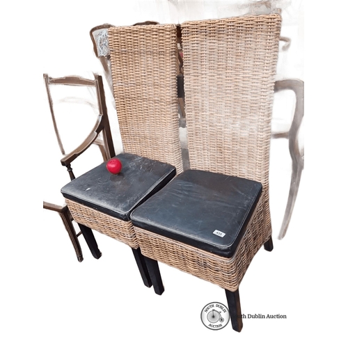 435 - Pair of wicker chairs with high backs and black leather cushions. Dimensions: 100 cm high, 40 cm sea... 