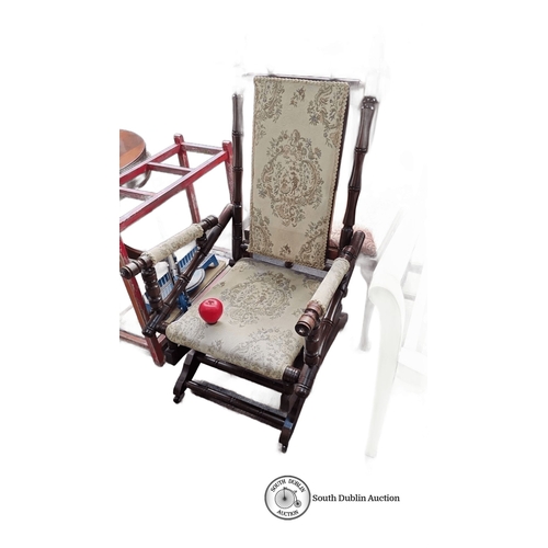 439 - An American antique mahogany rocking chair featuring beautiful tapestry upholstery and braiding with... 