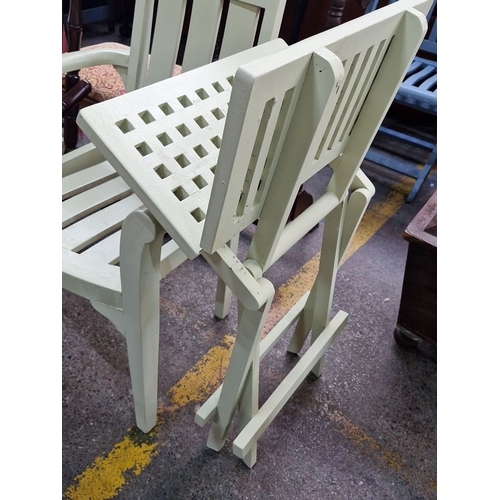 440 - A set of two pastel green wooden garden chairs and matching folding table. Each chair measures 90cm ... 