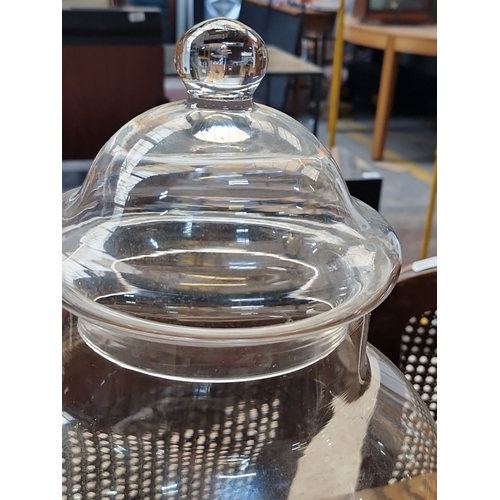 443 - A large clear glass apothecary jar with lid. Measures approximately 40 cm in height.