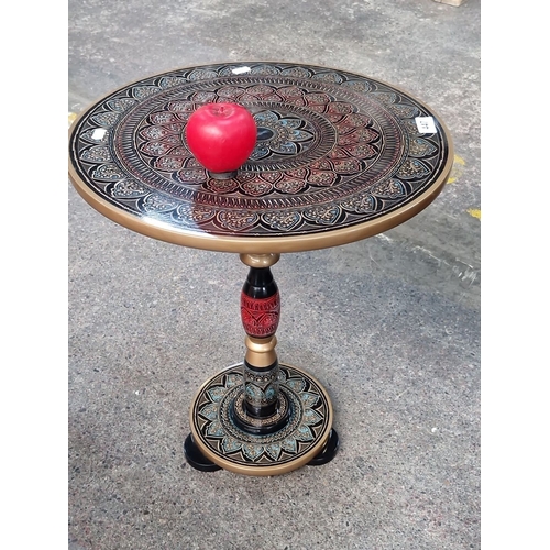 447 - A very pretty hand-painted wooden pedestal table with intricate mandala design in red, blue, and gol... 