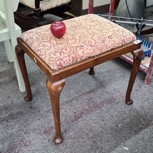 448 - A vintage wooden stool with red damask upholstery and cabriole legs. Approximately 45cm high, 50cm w... 