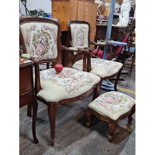 454 - Set of two carved mahogany armchairs and footstool with tapestry upholstery. Approximately chairs: 3... 