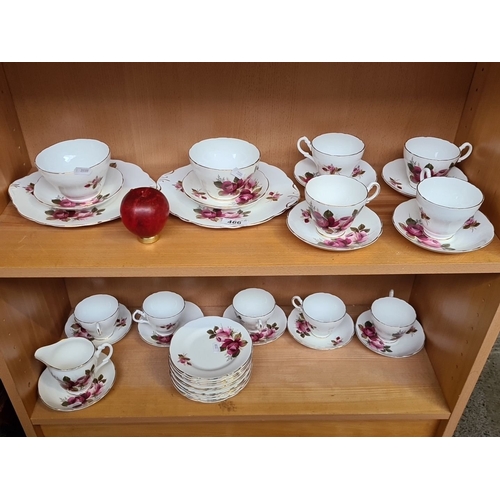 466 - A Grosvenor Bone China tea set with floral motif, made in England by Jackson & Gosling Ltd. Includes... 