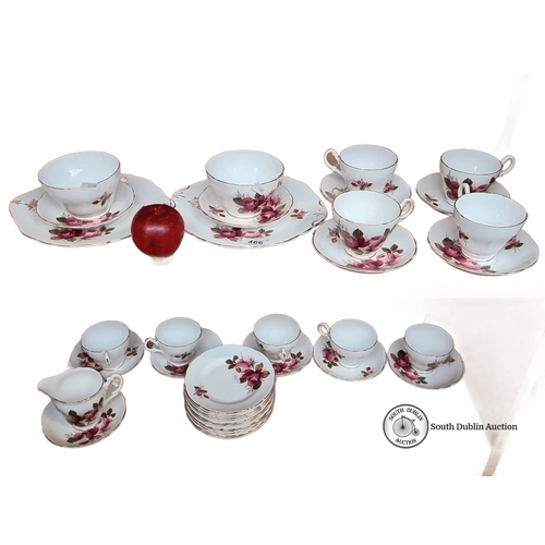 466 - A Grosvenor Bone China tea set with floral motif, made in England by Jackson & Gosling Ltd. Includes... 