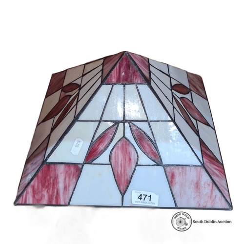 471 - A superb stained glass lampshade featuring a geometric and floral design with red and white panels.