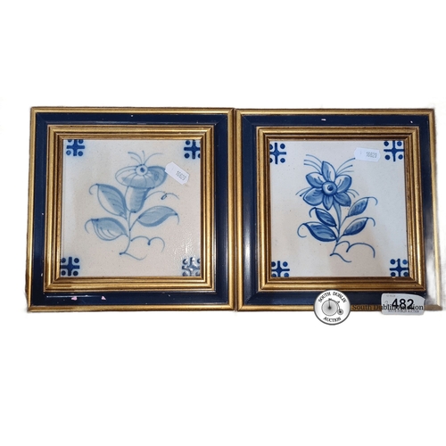 482 - Pair of framed Delft-style ceramic tiles with blue floral motifs, set in wooden gilt frames. Each fr... 