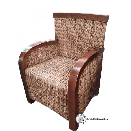 492 - A rather sweet woven natural fiber armchair with wooden frame. Approximately 21 inches high, 15 inch... 