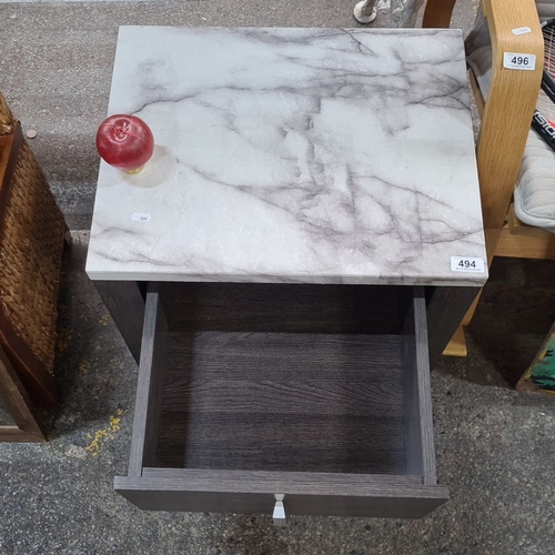 494 - A stylish side table with a marble effect top and dark wood finish, featuring a single pull-out draw... 