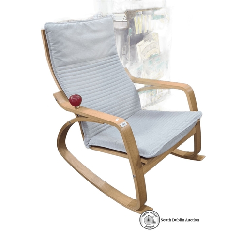 496 - A sleek and stylish oak rocking chair with light grey cushioned seat and backrest. Approximately 100... 