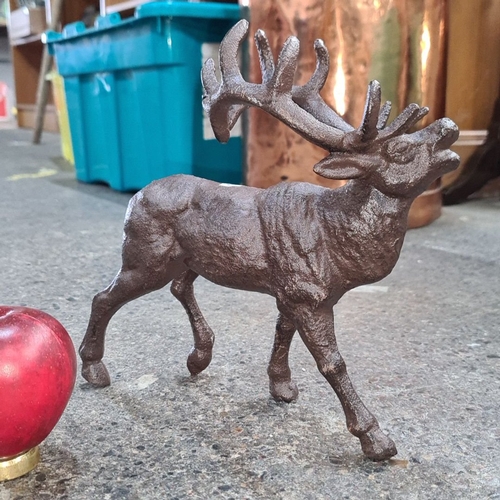 499 - A heavy cast metal stag sculpture, approximately 6 inches in height. Boasting a lovely rustic finish... 