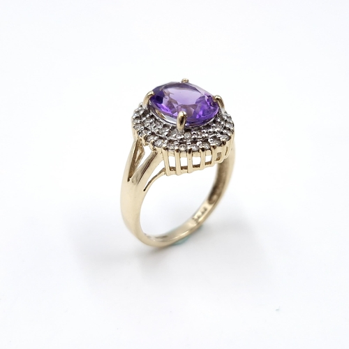 1 - Star Lot : A very nice example of a nine carat gold diamond and large amethyst gemstone ring. Ring s... 