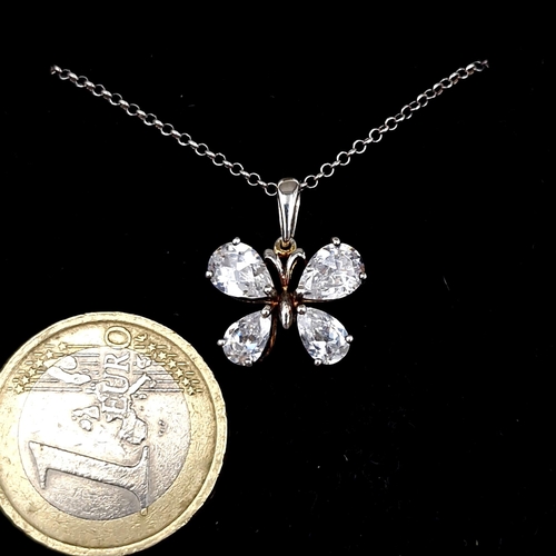 18 - A sterling silver (925) butterfly designed gemstone pendant and chain. Length - 42 cms.