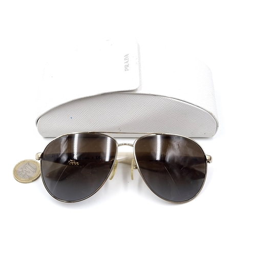 22 - A pair of original designer Prada aviator style sunglasses 'Made in Italy'. Marked polarised and ser... 