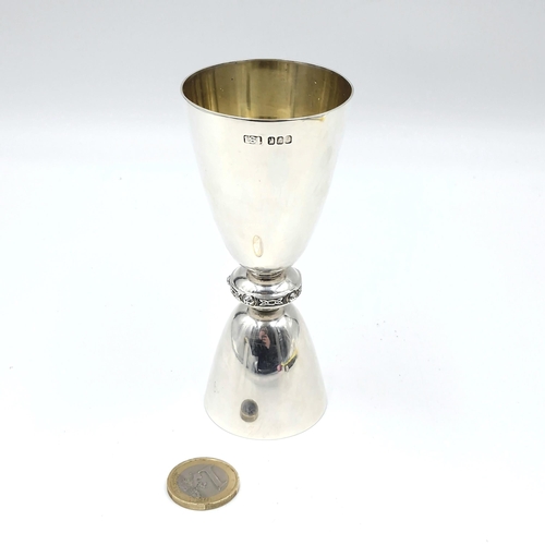 25 - Star Lot : A Super Irish silver spirits double measure set with a celtic band and silver gilt lining... 