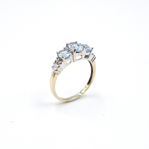 3 - Star lot : A stunning nine carat gold three stone topaz ring set with diamonds. Size - O. Weight - 2... 