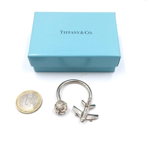 35 - An original  925 Tiffany & Co. key ring in the form of a world & aeroplane. Dimensions: 4 x 3 cms. W... 