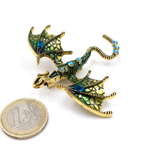 37 - A multi coloured gemstone brooch in the form of a dragon. Dimensions: 7 x 6 cms. Weight - 13 grams. ... 