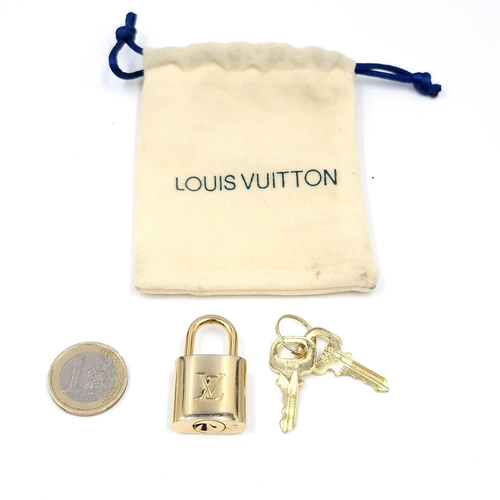 38 - An original  Louis Vuitton pad lock. Weight - 31.52 grams.