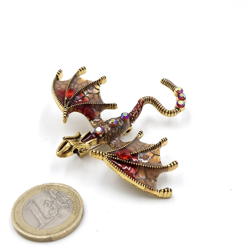 40 - A very attractive multi gem set dragon brooch. Dimensions: 7 x 6 cms. Weight - 15.42 grams. Pin inta... 