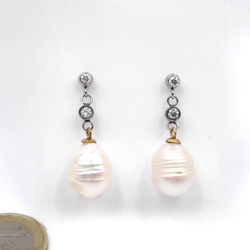 43 - Star Lot : A pair of four diamond set and Akoya pearl stud drop earrings. Total weight - 6.4 grams. ... 