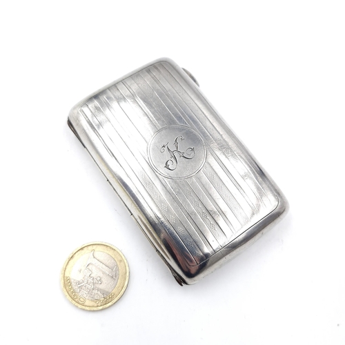 45 - A nice example of an antique sterling silver cigarette box with hinged lid and the letter 'K' inscri... 