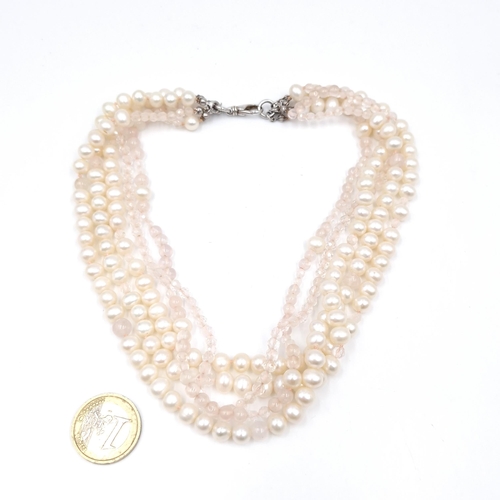 52 - A multi strand pearl & crystal choker necklace. Length - 38 cms. Weight - 92 grams.