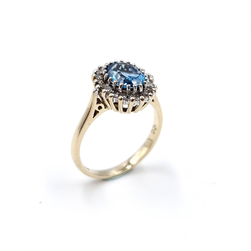 8 - Star Lot : A fine example of a large blue topaz stone ring set with diamond surround mounted in nine... 