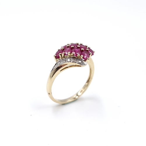 9 - Star Lot A very pretty nine carat gold ruby and diamond dress ring. Ring size - O. Weight - 2.78 gra... 