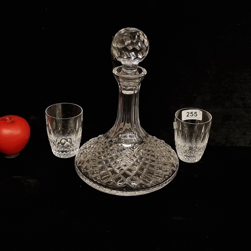 255 - A stunning Waterford Crystal three piece set including two tumbler glasses and a matching decanter w... 