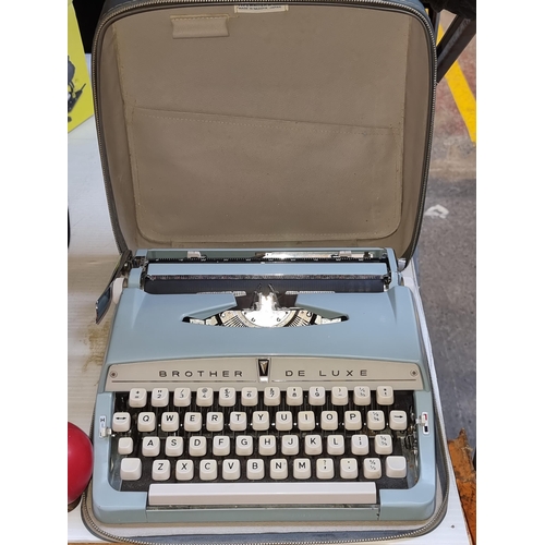 371 - A vintage Brother Deluxe typewriter in original carry case. In nice condition.