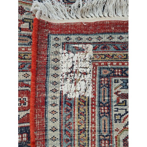 689 - Super Star Lot: A fabulous, very large, quality hand knotted rug in a geometric pattern predominantl... 