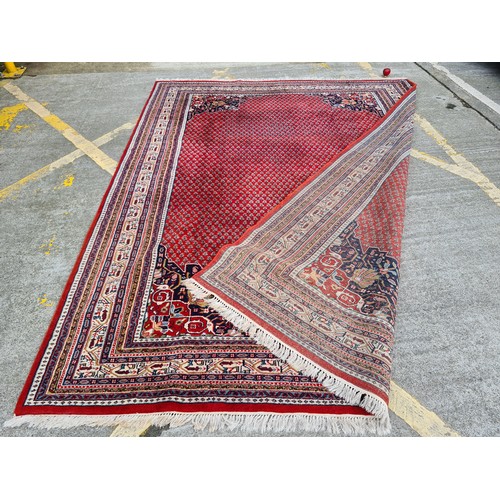 689 - Super Star Lot: A fabulous, very large, quality hand knotted rug in a geometric pattern predominantl... 