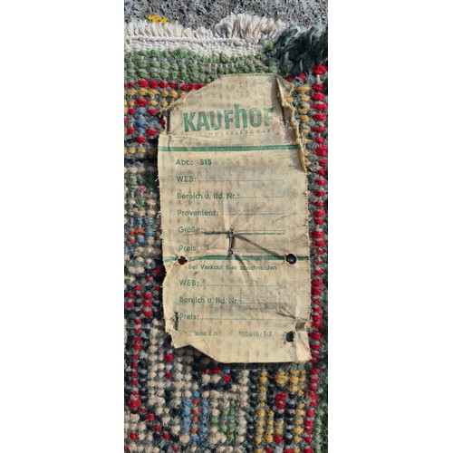 692 - Star Lot: An exquisite example of a hand knotted 100% wool pile runner rug, made in India. The tones... 