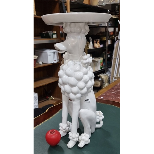 629 - White ceramic Kare Design poodle sculpture table. Approximately 24 inches tall. It's a bit poodle an... 