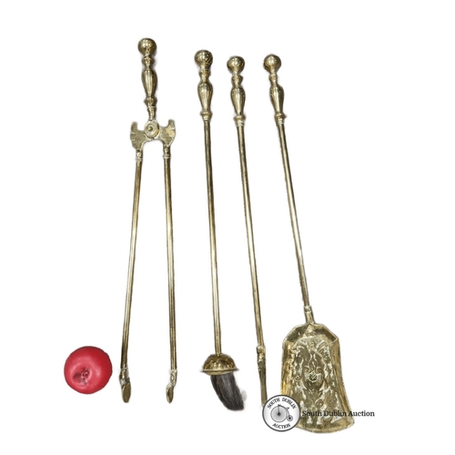 633 - Set of four brass Victorian-style fireplace tools comprising tongs, poker, brush, and shovel. Elegan... 