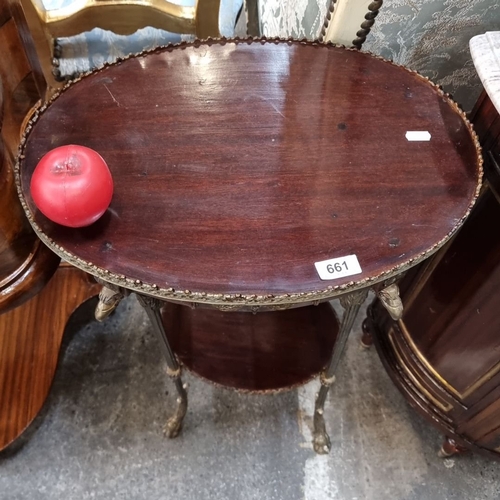 661 - Star Lot : A stunning French side table with ornate bronze trim, featuring dual tiers and claw-foot ... 